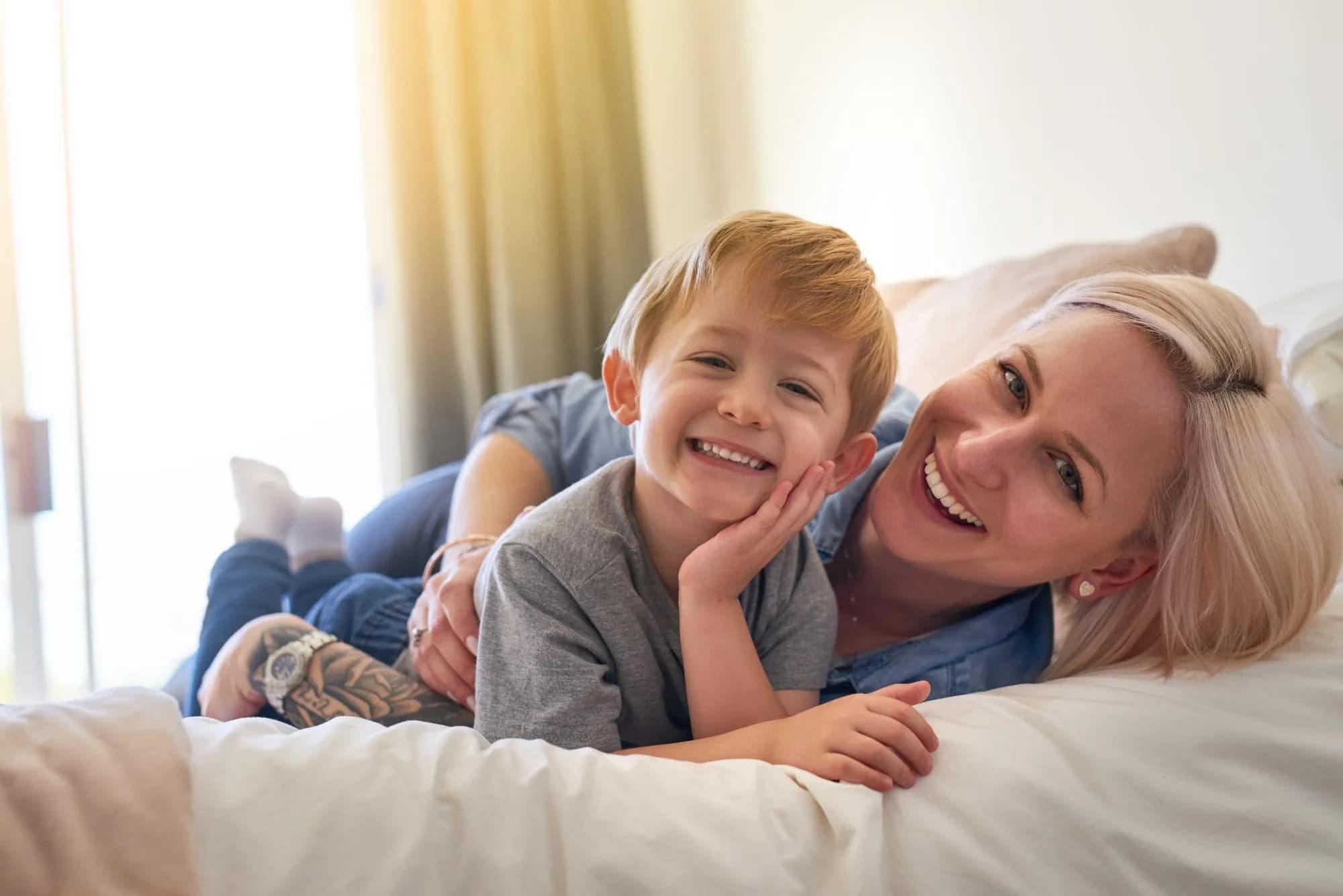 Mother and son laughing together — family dentistry at All Smiles Dental Care, Calgary