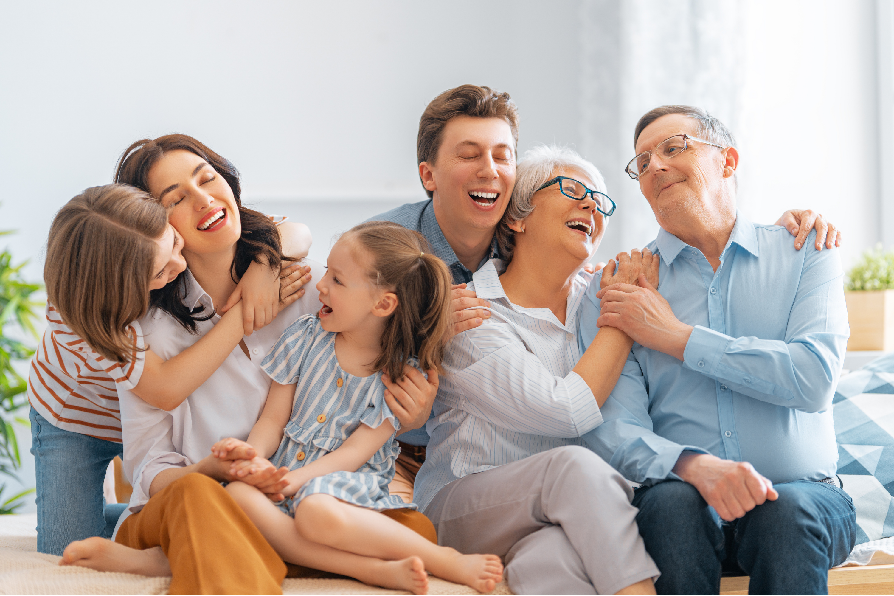 Multi-generational family laughing together — All Smiles Dental Care