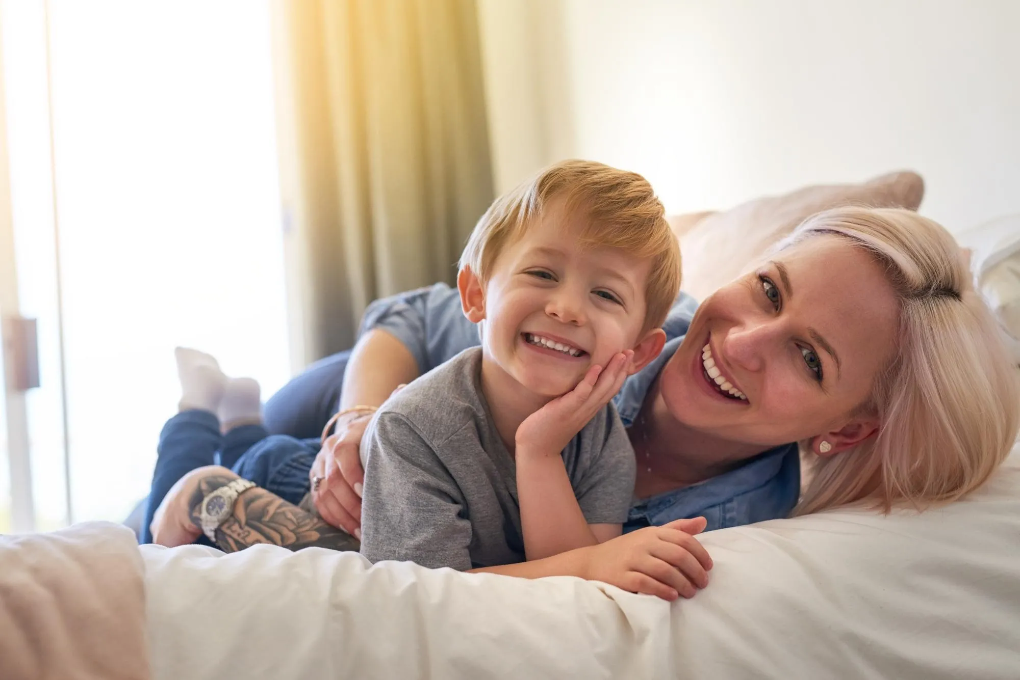 Mother and son laughing together — family dentistry at All Smiles Dental Care, Calgary